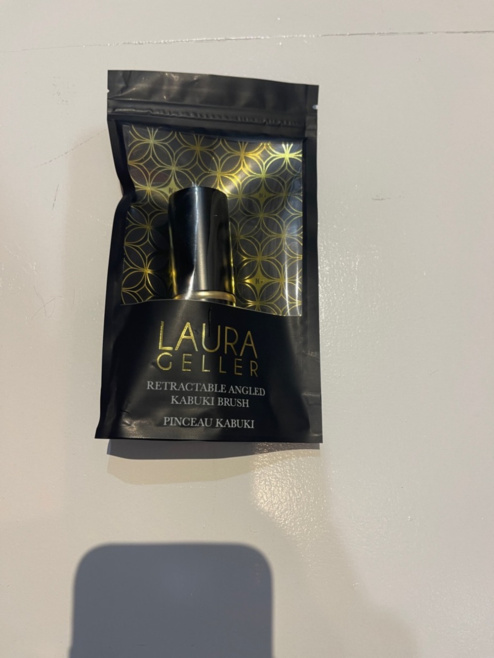 Laura Geller Black and Gold Retractable Angled Kabuki Brush